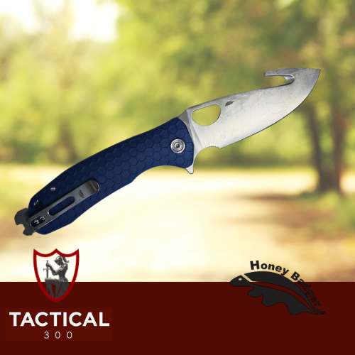Beretta x Honey Badger Cross-Bolt Drop-Point Medium/Large folding knife with blue honeycomb-textured handle, stainless steel drop-point blade, integrated choke key feature, and Beretta 500-year commemorative branding.